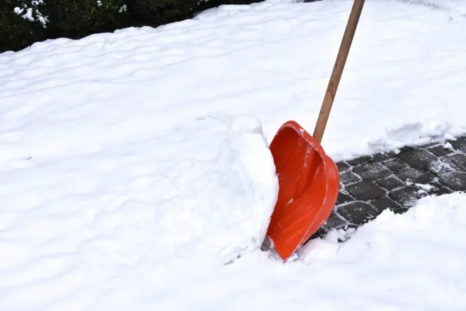 Shovelling snow before gritting